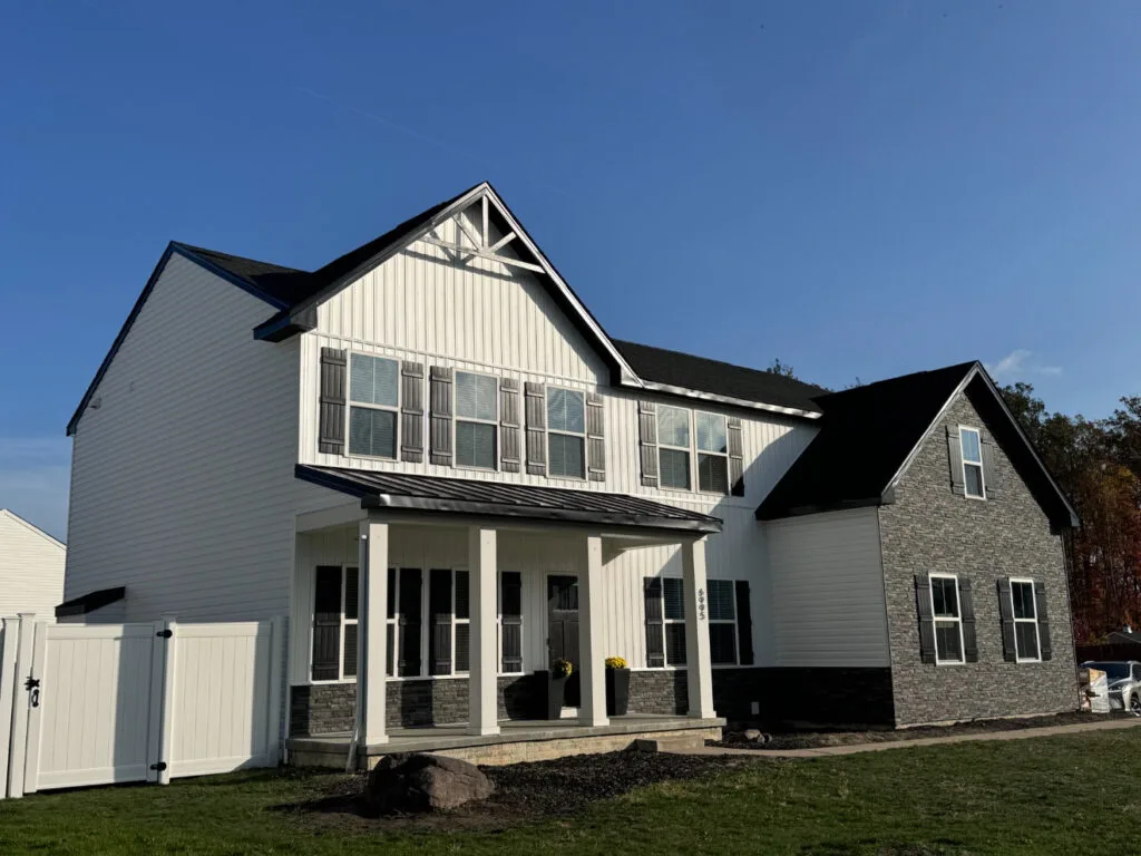 Modern house with white board and batten siding